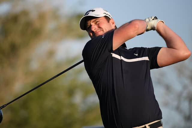 Marc Warren plays his tee shot on the 18th hole during day one of the Golf in Dubai Championship at Jumeirah Golf Estates . Picture: Ross Kinnaird/Getty Images