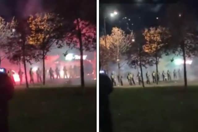A video has shown the moment riot police were attacked with fireworks in Niddrie