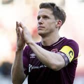 Former Hearts skipper Christophe Berra recently announced his decision to retire. Here he applauds the fans after a game v Aberdeen in 2019