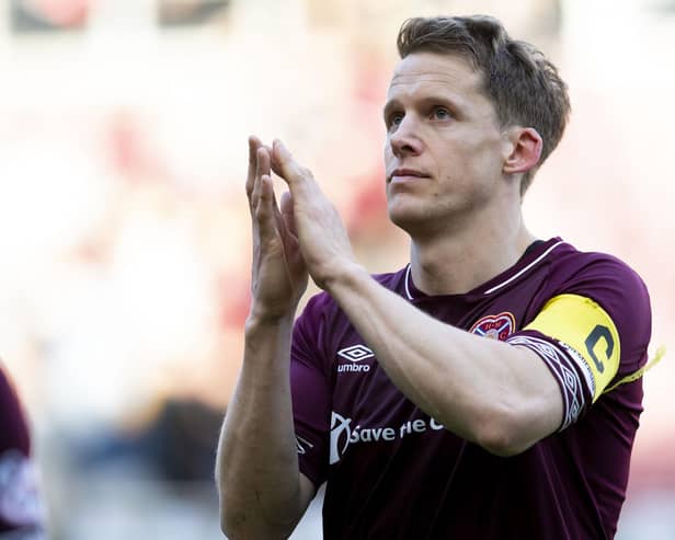 Former Hearts skipper Christophe Berra recently announced his decision to retire. Here he applauds the fans after a game v Aberdeen in 2019