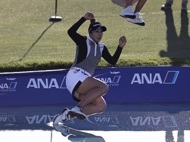 Patty Tavatanakit of Thailand celebrates winning the 2021 ANA Inspiration by taking the traditional leap into Poppie’s Pond. That will be happening for the last time in 2022 before the newly-named Chevron Championship moves to a new home. Picture: Michael Owens/Getty Images.