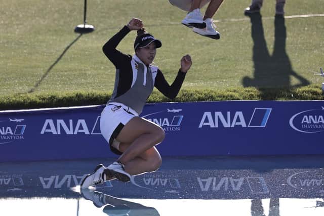 Patty Tavatanakit of Thailand celebrates winning the 2021 ANA Inspiration by taking the traditional leap into Poppie’s Pond. That will be happening for the last time in 2022 before the newly-named Chevron Championship moves to a new home. Picture: Michael Owens/Getty Images.