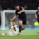 John McGinn of Scotland is tackled by Lasha Dvali of Georgia during the match at Hampden.