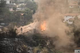 A house burning during a wildfire in Avanta, near Alexandroupoli, northern Greece. Wildfires have hot the region in the past few days.