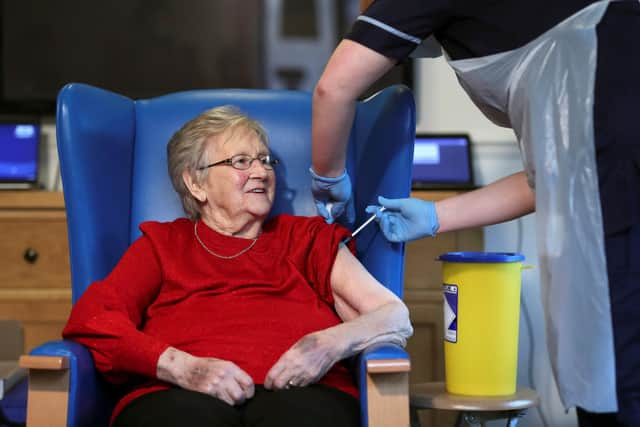 Resident Annie Innes, 90, receiving the Pfizer/BioNTech COVID-19 vaccine at the Abercorn House Care Home in Hamilton.