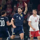 Scotland's Kieran Tierney celebrates making it 1-0 over Poland. (Photo by Ross Parker / SNS Group)