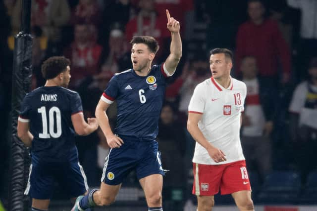 Scotland's Kieran Tierney celebrates making it 1-0 over Poland. (Photo by Ross Parker / SNS Group)