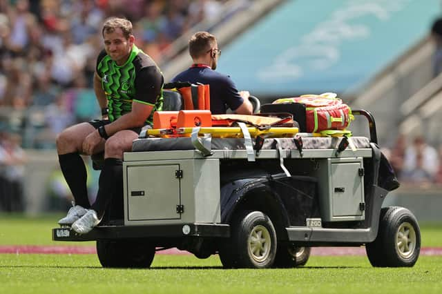 Fraser Brown is carried off after rupturing his ACL while playing for the World XV during the Killik Cup match against the Barbarians at Twickenham Stadium on May 28. (Photo by David Rogers/Getty Images)