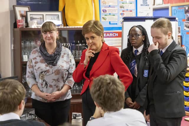 First Minister Nicola Sturgeon talking to pupils in a Modern Studies class during her visit to Whitehill Secondary School in Glasgow. Picture: Robert Perry/PA Wire