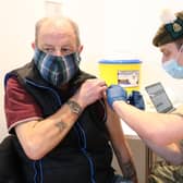 Derek Fraser from Edinburgh receiving a Covid-19 vaccine from military doctor Captain Robert Reid in February.