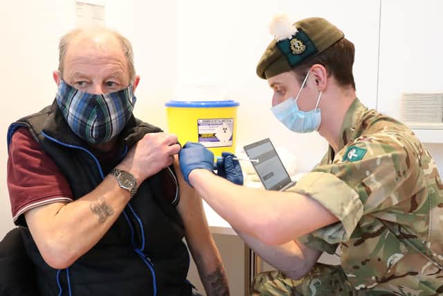 Derek Fraser from Edinburgh receiving a Covid-19 vaccine from military doctor Captain Robert Reid in February.