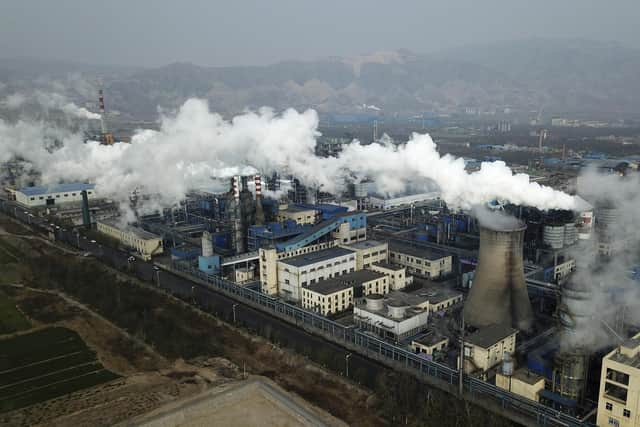 Smoke and steam rise from a coal processing plant in Hejin in central China's Shanxi Province