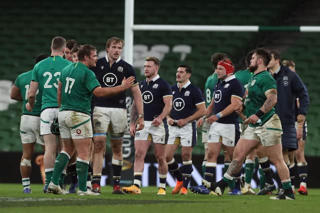 Scotland players are comforted by Ireland after the 31-16 defeat in the Autumn Nations Cup third-place play-off in Dublin.