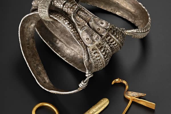 Silver arm rings and gold items, including a bird pin, found among the hoard which contains around 100 objects in total. PIC: NMS.