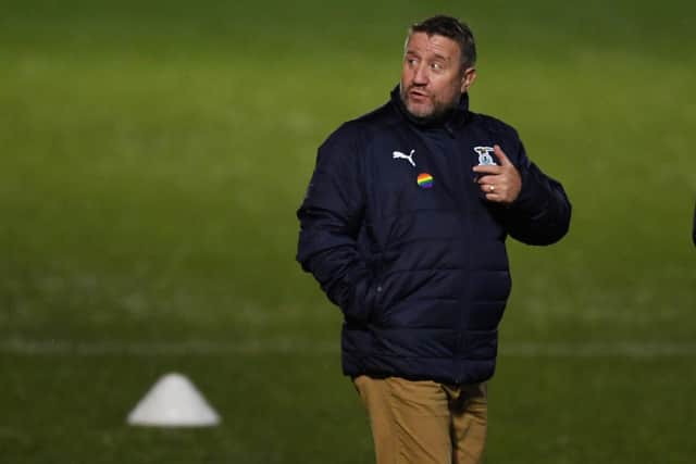 Inverness Caledonian Thistle manager John Robertson - still signing tickets (Photo by Ross MacDonald / SNS Group)
