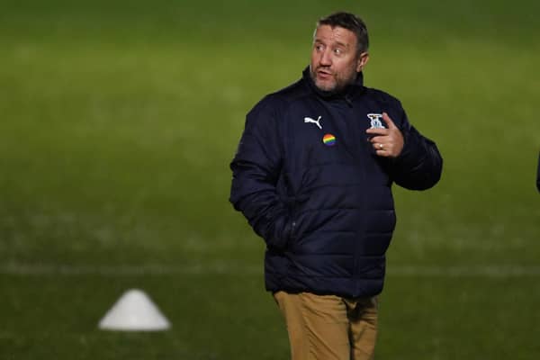 Inverness Caledonian Thistle manager John Robertson - still signing tickets  (Photo by Ross MacDonald / SNS Group)