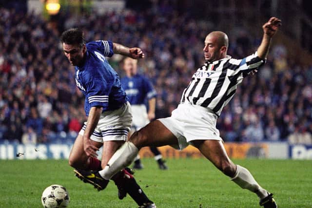 Rangers midfielder Ian Ferguson (left) is challenged by Juventus captain Gianluca Vialli during a Champions League fixture at Ibrox in 1995.