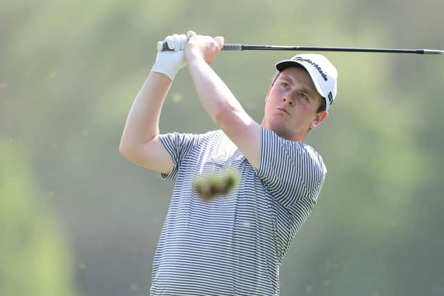 DUBAI, UNITED ARAB EMIRATES - NOVEMBER 21: Robert MacIntyre of Scotland plays his second shot to the 3rd hole during Day Four of The DP World Tour Championship at Jumeirah Golf Estates on November 21, 2021 in Dubai, United Arab Emirates. (Photo by Warren Little/Getty Images)
