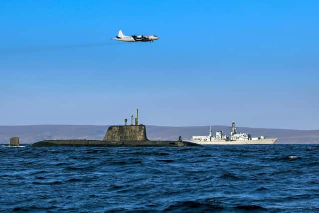 An Astute class nuclear submarine in company with the Type 23 frigate HMS Kent being over flown by a German Navy P3 maritime patrol aircraft (Pic: Royal Navy)