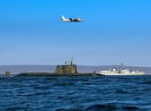 An Astute class nuclear submarine in company with the Type 23 frigate HMS Kent being over flown by a German Navy P3 maritime patrol aircraft (Pic: Royal Navy)