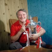Tommy Docherty with the FA Cup after Manchester United's win in 1977