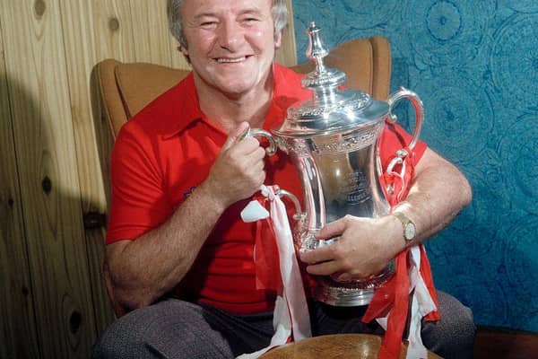 Tommy Docherty with the FA Cup after Manchester United's win in 1977
