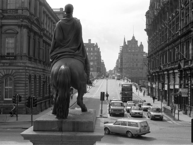 Looking up North Bridge in Edinburgh, with the Scotsman newspaper building on the right, from behind the Duke of Wellington's statue in May 1986.