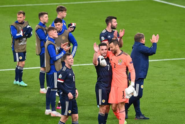 John McGinn and David Marshall of Scotland interact after the draw at England.
