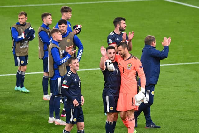 John McGinn and David Marshall of Scotland interact after the draw at England.