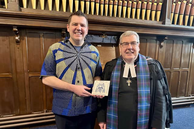 Rev Fraser Edwards pictured with a gift from Rt Rev Dr Shaw Paterson.