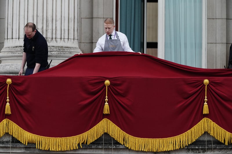Final preparations on the balcony of Buckingham Palace, London, ahead of the Coronation of King Charles III and Queen Camilla today