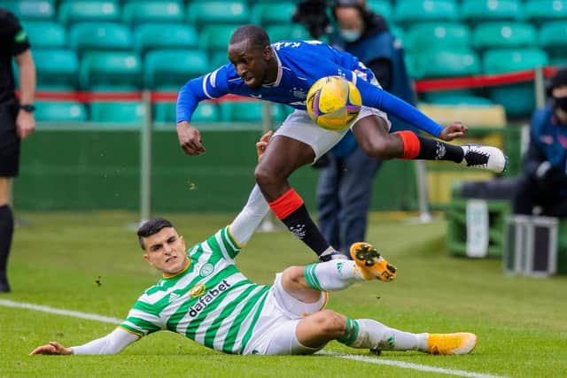 Glen Kamara hurdles a challenge from Mohamed Elyounoussi during Rangers 2-0 win over Celtic at Parkhead. (Photo by Craig Williamson / SNS Group)