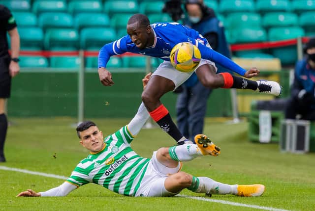 Glen Kamara hurdles a challenge from Mohamed Elyounoussi during Rangers 2-0 win over Celtic at Parkhead. (Photo by Craig Williamson / SNS Group)