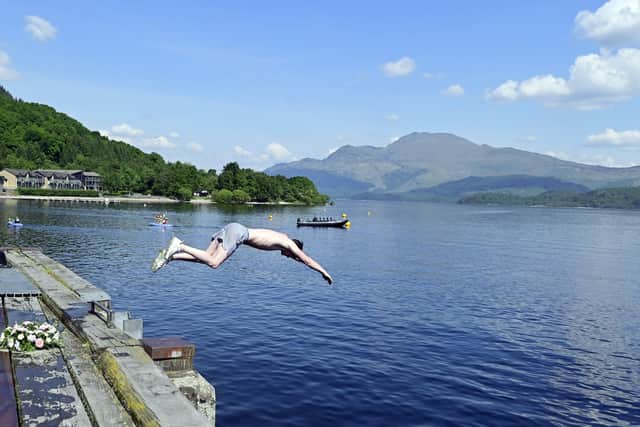 A swimmer at Loch Lomond. Scots in some parts of the country can expect temperatures around 24C to 26C - possibly even 27C in the north-east of the country on Monday. Picture: John Devlin