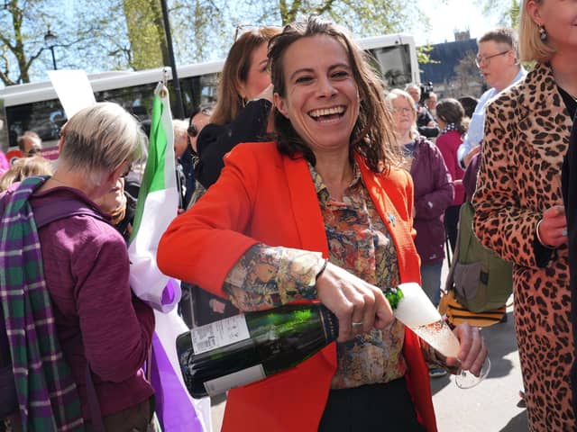 Campaigners celebrate outside the Supreme Court in London after judges ruled the terms 'woman' and 'sex' in the Equality Act refer to a biological woman and biological sex (Picture: Lucy North/PA Wire)
