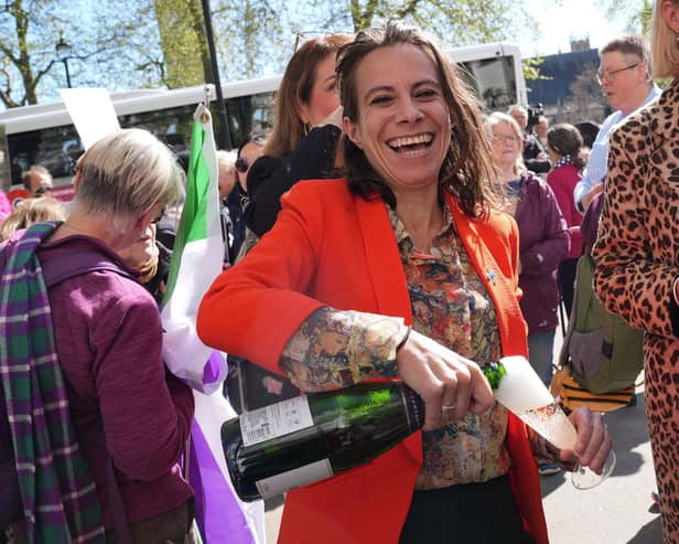 Campaigners celebrate outside the Supreme Court in London after judges ruled the terms 'woman' and 'sex' in the Equality Act refer to a biological woman and biological sex (Picture: Lucy North/PA Wire)