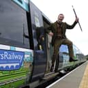 A man dressed as Sir Walter Scott celebrates the creation of Borders Railway service, which re-established a section of the old Waverley route, in 2015 (Picture: Andy Buchanan/AFP via Getty Images)