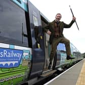 A man dressed as Sir Walter Scott celebrates the creation of Borders Railway service, which re-established a section of the old Waverley route, in 2015 (Picture: Andy Buchanan/AFP via Getty Images)