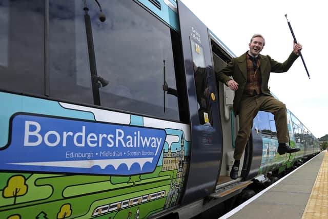 A man dressed as Sir Walter Scott celebrates the creation of Borders Railway service, which re-established a section of the old Waverley route, in 2015 (Picture: Andy Buchanan/AFP via Getty Images)