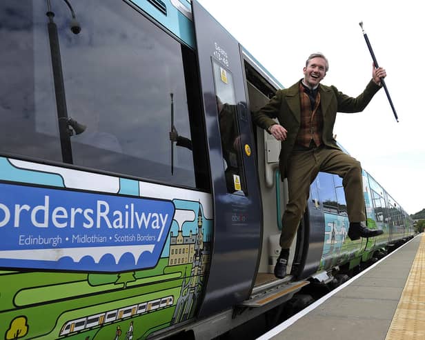 A man dressed as Sir Walter Scott celebrates the creation of Borders Railway service, which re-established a section of the old Waverley route, in 2015 (Picture: Andy Buchanan/AFP via Getty Images)