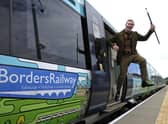 A man dressed as Sir Walter Scott celebrates the creation of Borders Railway service, which re-established a section of the old Waverley route, in 2015 (Picture: Andy Buchanan/AFP via Getty Images)
