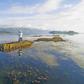 The view across Loch Linnhe to the Morvern Mountains with the Sgeir Bhuidhe Lighthouse in the foreground