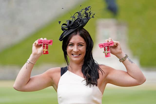 Olympic curler Eve Muirhead poses with her medals after being awarded an OBE in June to add to the MBE received two years earlier. (Photo by ANDREW MATTHEWS/POOL/AFP via Getty Images)