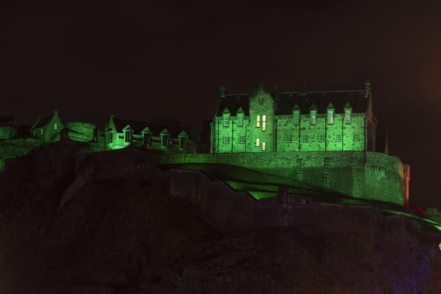 Edinburgh Castle lit up green for NSPCC. Picture, Alan Simpson