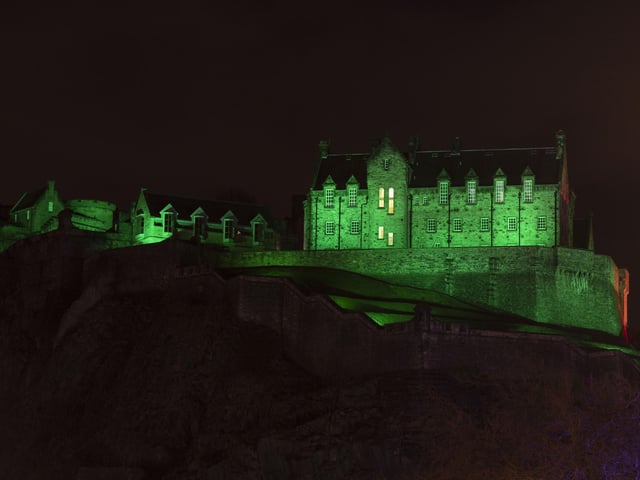 Edinburgh Castle lit up green for NSPCC. Picture, Alan Simpson