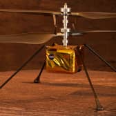 A full scale model of the experimental Ingenuity Mars Helicopter.