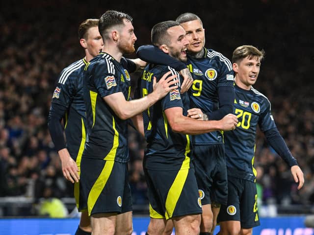 Scotland players celebrate John McGinn's winner against Croatia in a match broadast live free-to-air on YouTube. (Photo by Rob Casey / SNS Group)