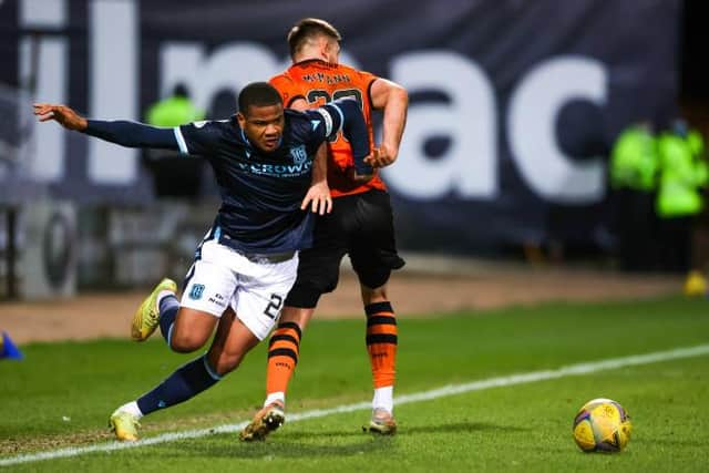Dundee debutant Vontae Daley-Campbell beats Dundee United's Scott McMann during the stalemate at Dens Park.  (Photo by Craig Williamson / SNS Group)