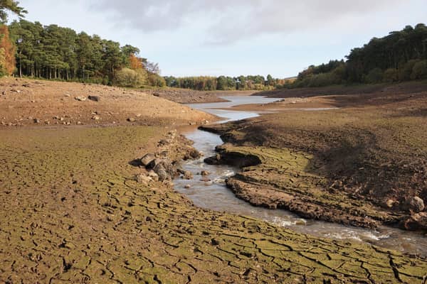 A drought at Threipmuir Reservoir in the Pentland Hills, near Edinburgh, following a long, hot summer in 2018. This view is looking across part of the deeply-cracked reservoir bed which would normally be under water.