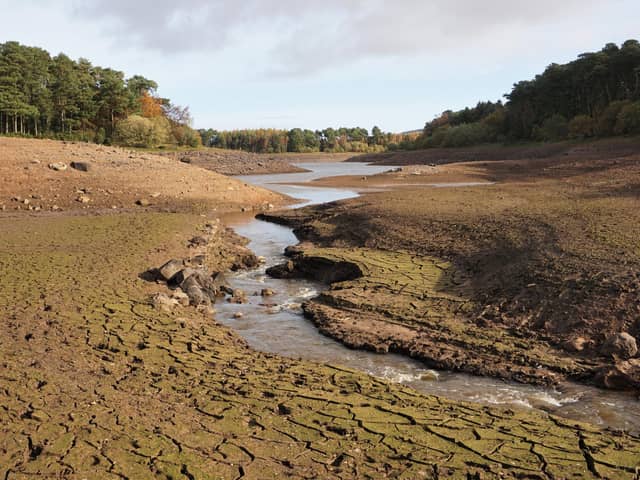 A drought at Threipmuir Reservoir in the Pentland Hills, near Edinburgh, following a long, hot summer in 2018. This view is looking across part of the deeply-cracked reservoir bed which would normally be under water.